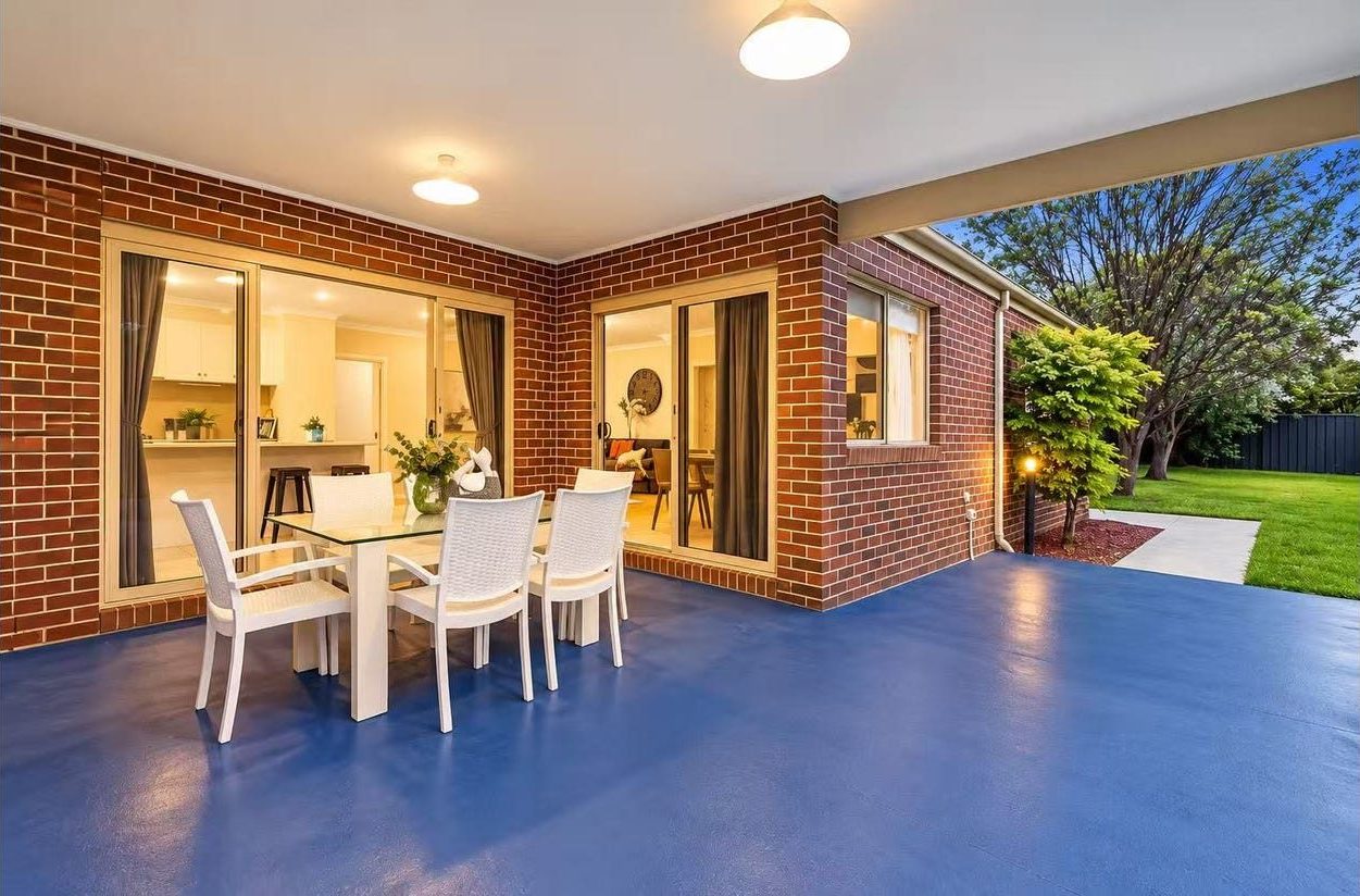 Exterior rear view of the residence showing the alfresco and established gardens